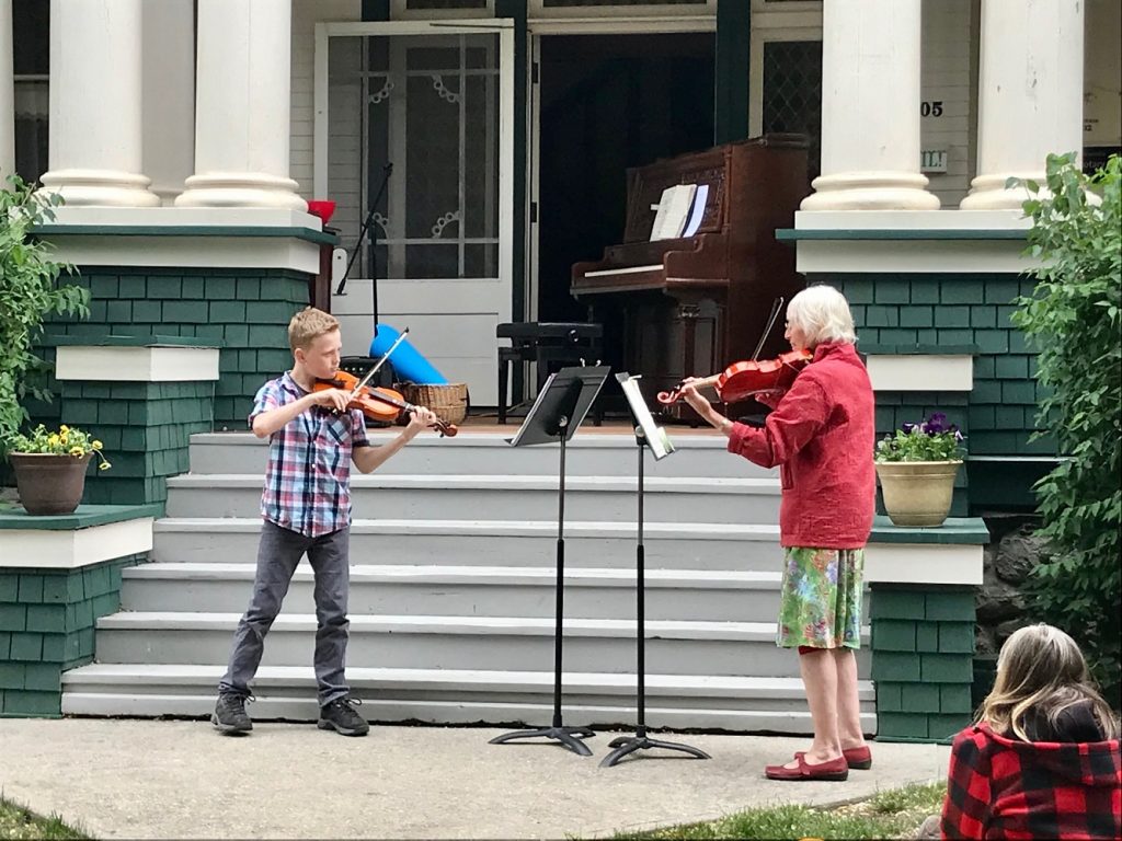 violin student performing in the outdoor recital at the Vernon Community Music School